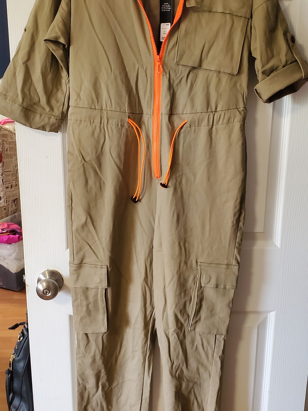New Fashion Nova cargo jumpsuit in olive green with vibrant orange zipper